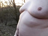 Chubby masturbates in the woods
