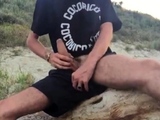 He wanks in the dunes