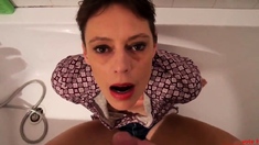 Short hair mature takes facial in the bathtub