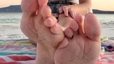 Sexy leggy brunette enjoys foot fetish