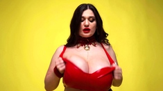 Busty babe playing with her big boobs