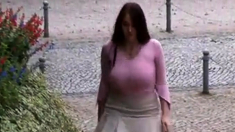 Busty girl walking, no bra, jiggling