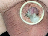 Pulling off condom from small spent dick
