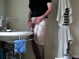 Demurely dressed crossdresser wanking and cumming